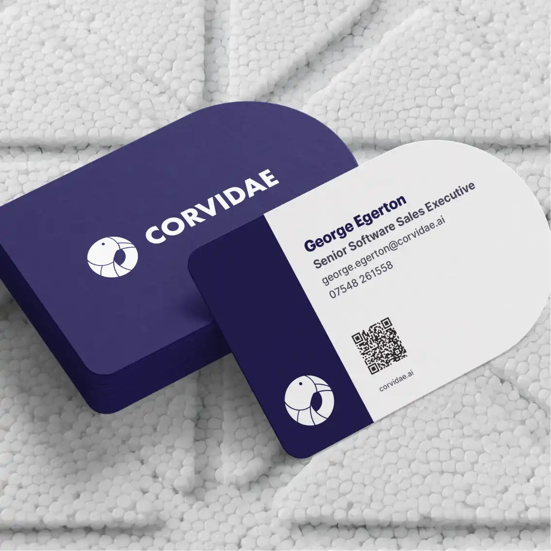 A pile of Corvidae business cards