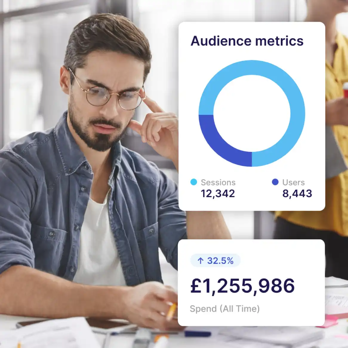 A marketer looking at printed information on a desk